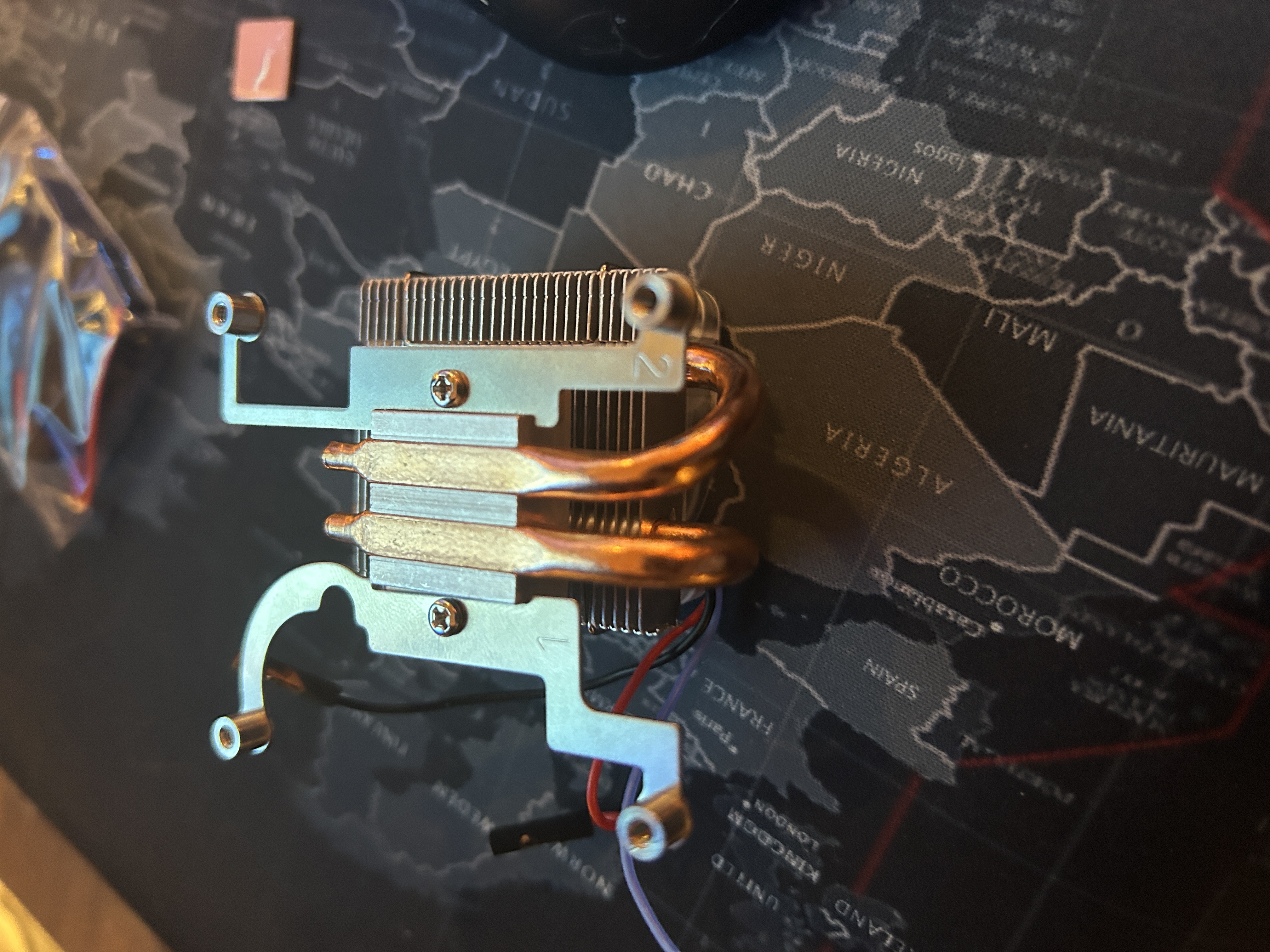 Close-up of the copper heat sink and mounting bracket.