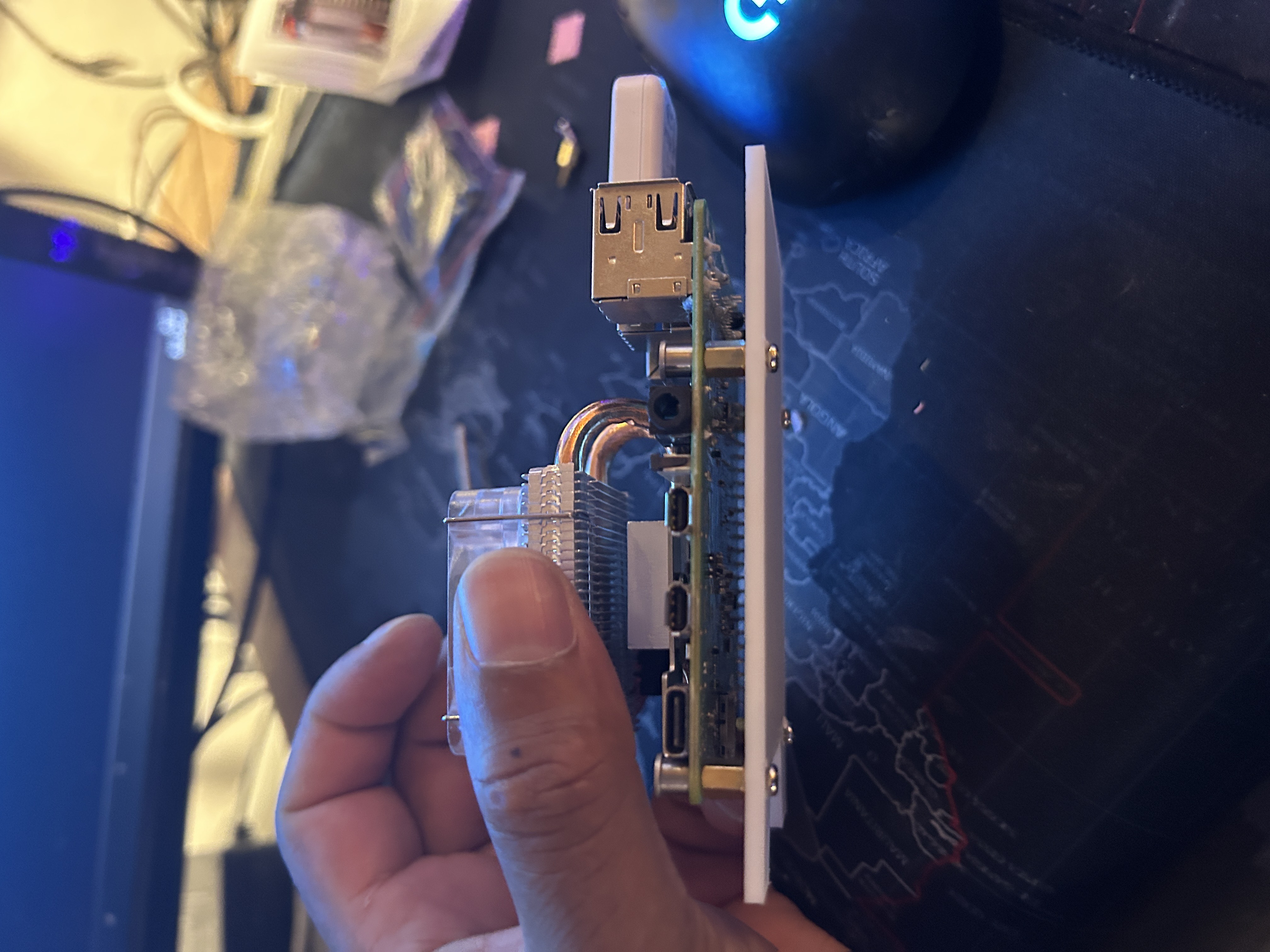 Raspberry Pi 4 with newly mounted cooling block on a support plate.