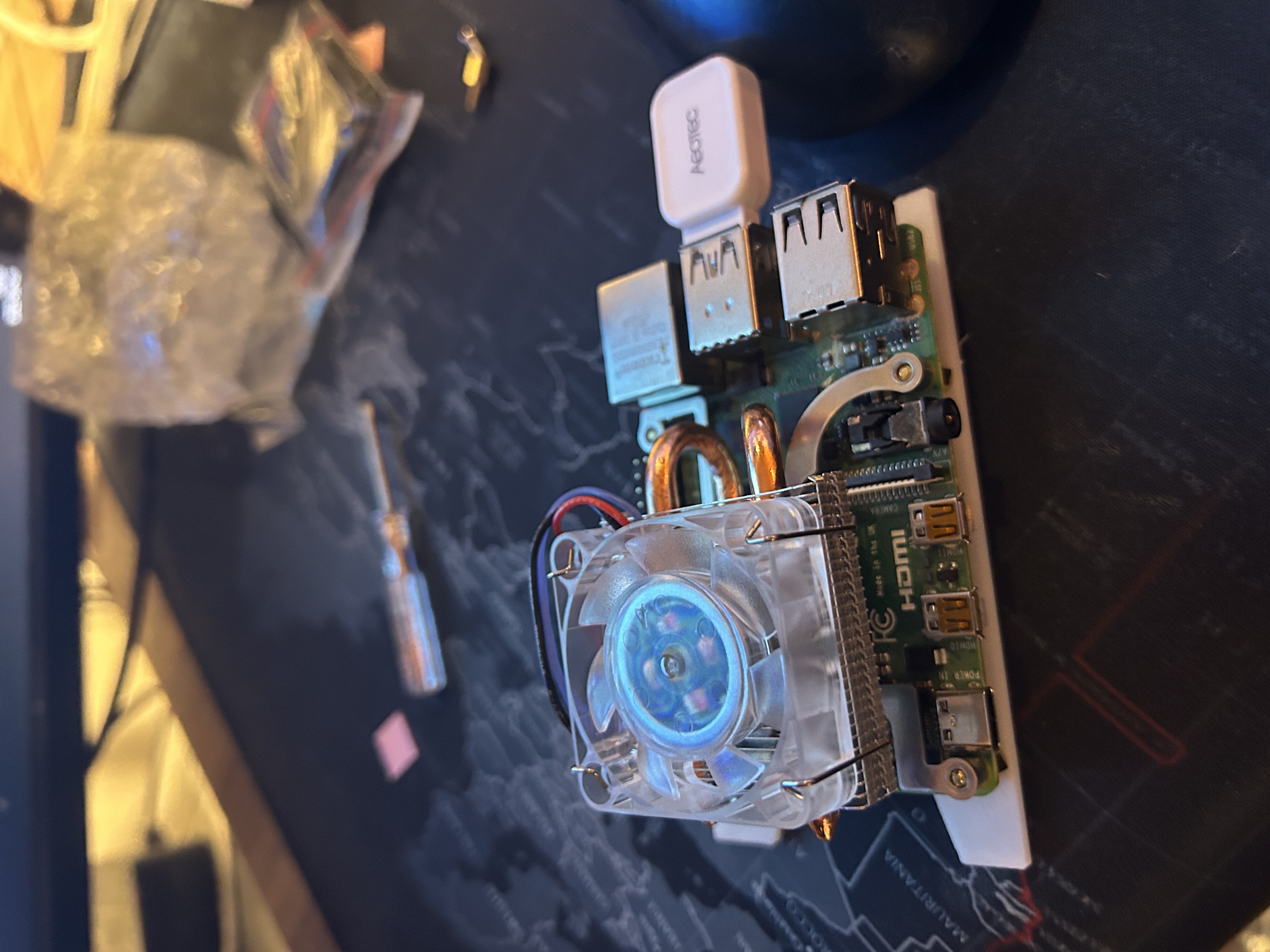 Raspberry Pi with cooling system and top-mounted transparent fan installed.