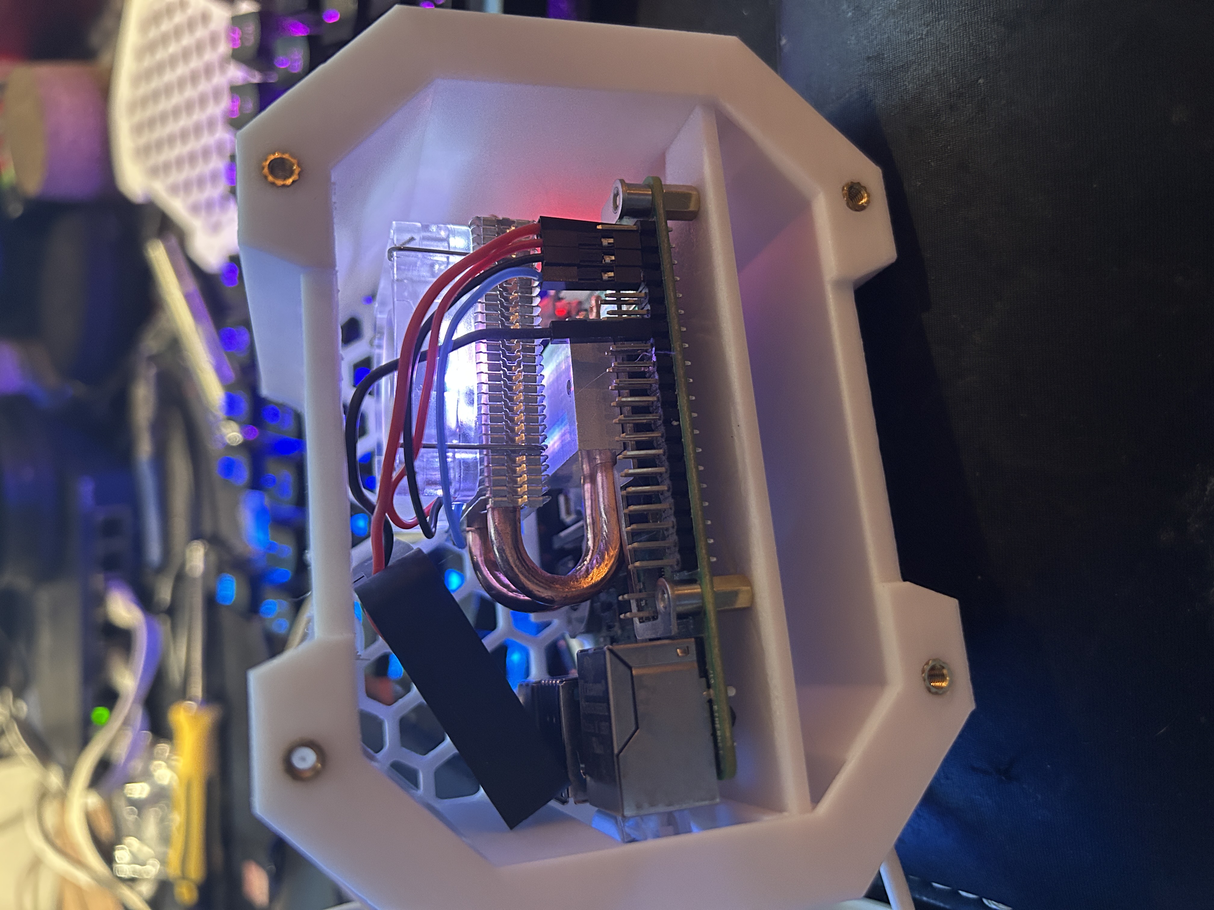 Chassis open, showing the cooling system with red LED glow in action.