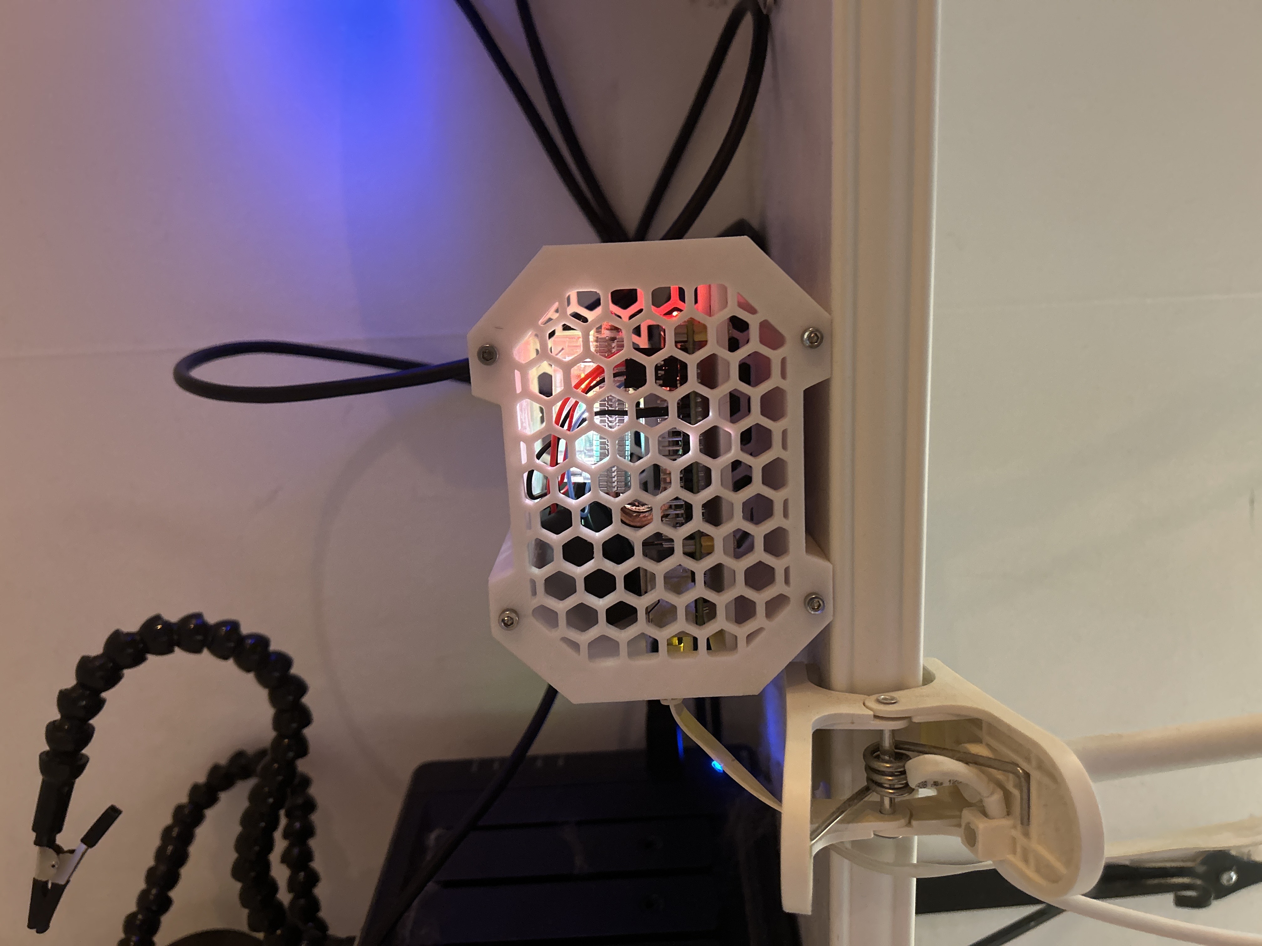 The finished build placed on a shelf, running inside its custom case.